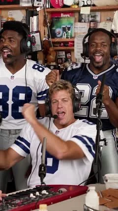 AI-generated Tiny Desk-style video frame of the Football legends at the keyboard and backing vocals