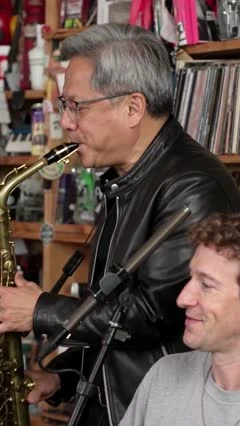 AI-generated Tiny Desk-style video frame of Jensen Huang playing saxophone